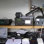 My shack and the eqipment: IC756PRO, ACOM 1000, matchboxes and laptop.